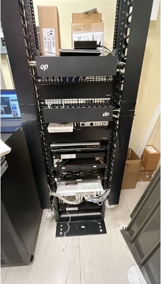 Network rack with patch panels, switches and firewall installed in a Petco store